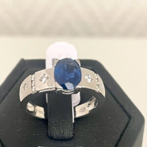 Bague or gris 750/000, saphir et diamants